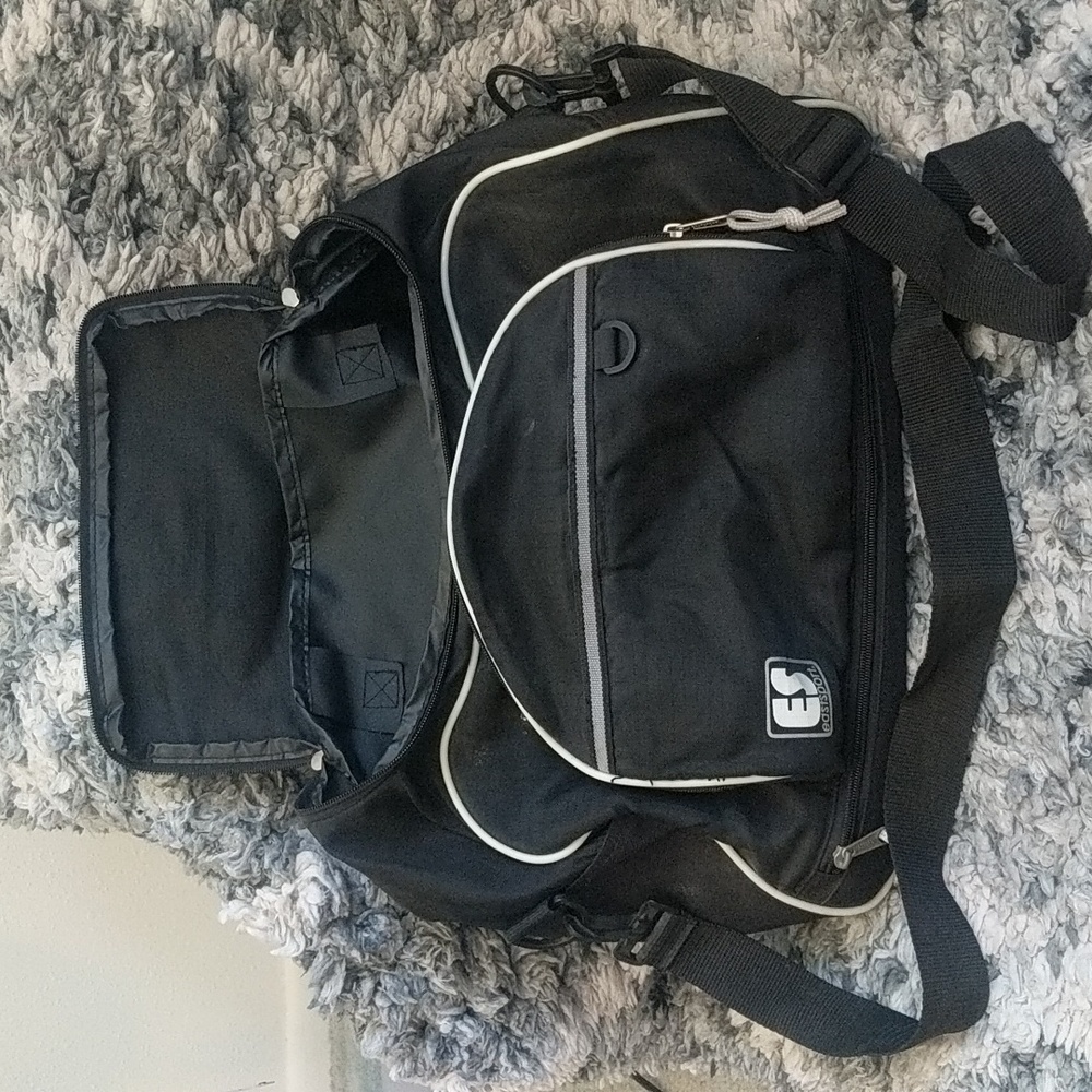 Black 17" East sport Duffle. Has both hand straps and adjustable shoulder strap